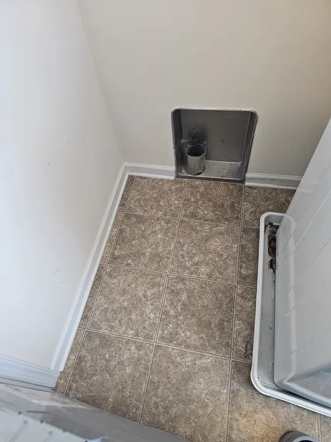 After: The same laundry closet clean with the dryer box cleared