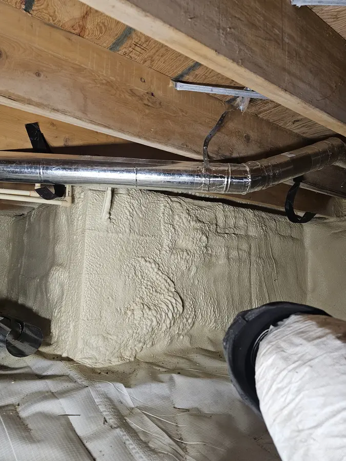 After: New metal duct with an elbow in the same crawlspace